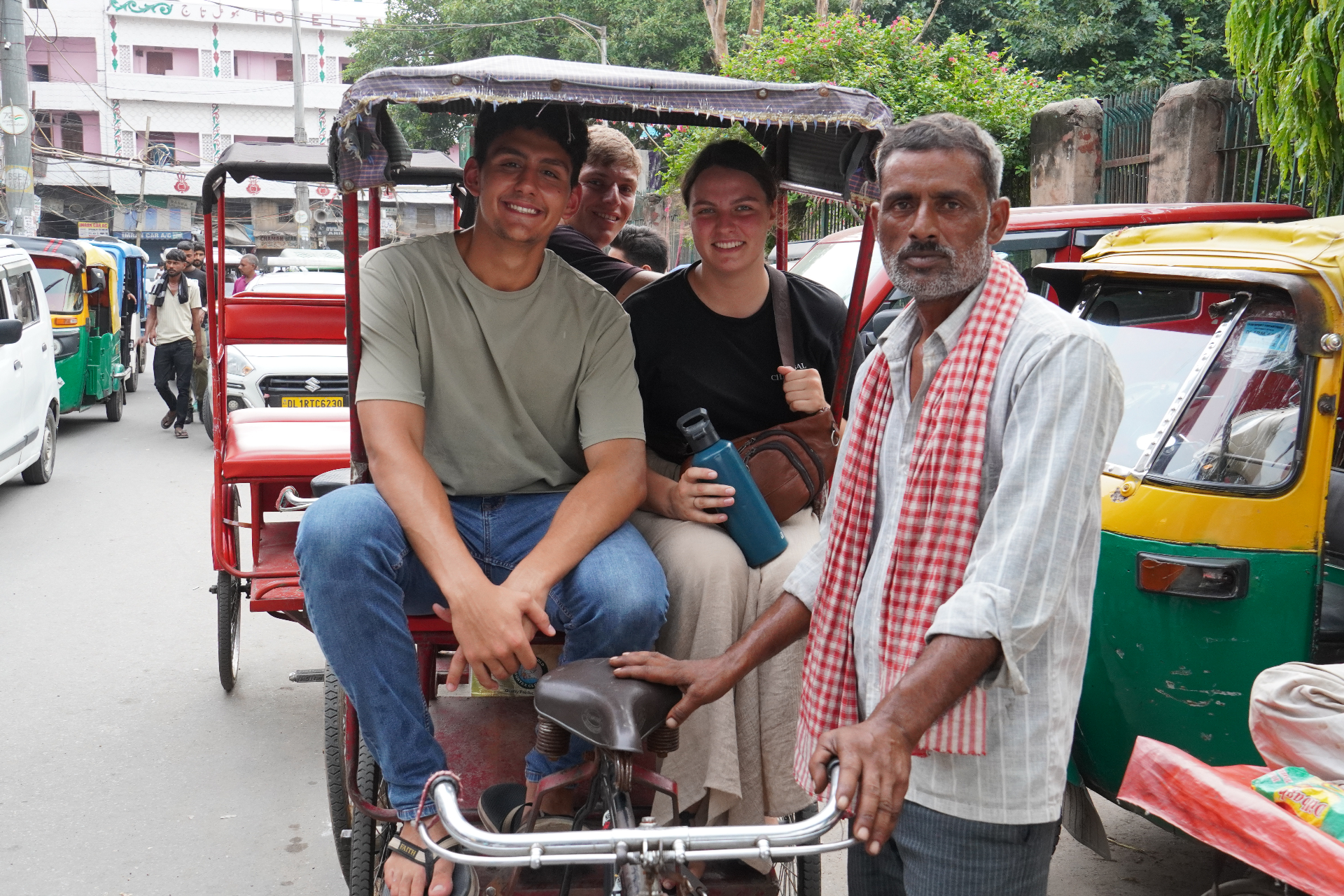 Travelers and a local friend gathered together in India