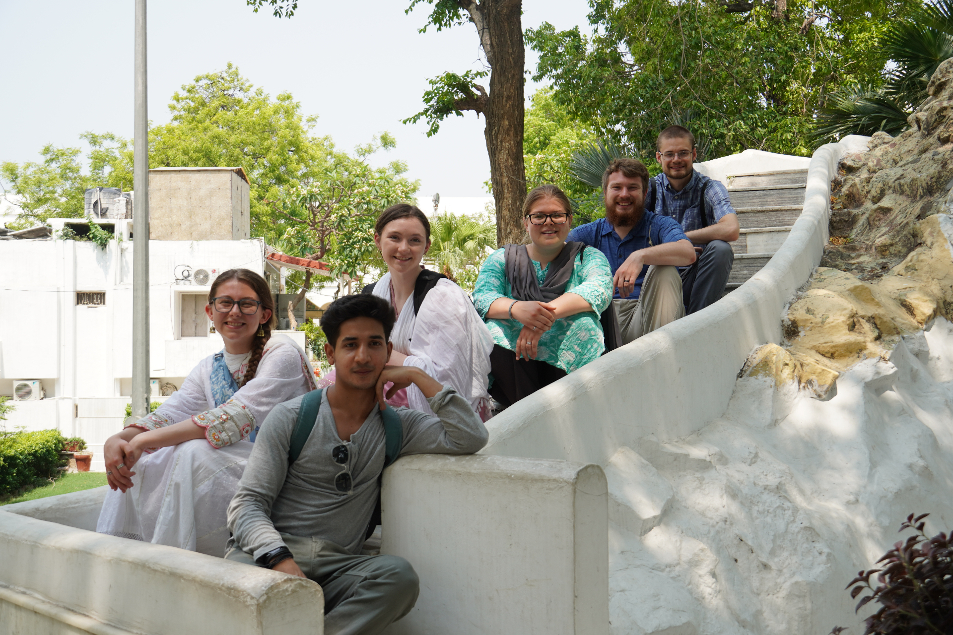 Travelers and a local friend gathered together in India